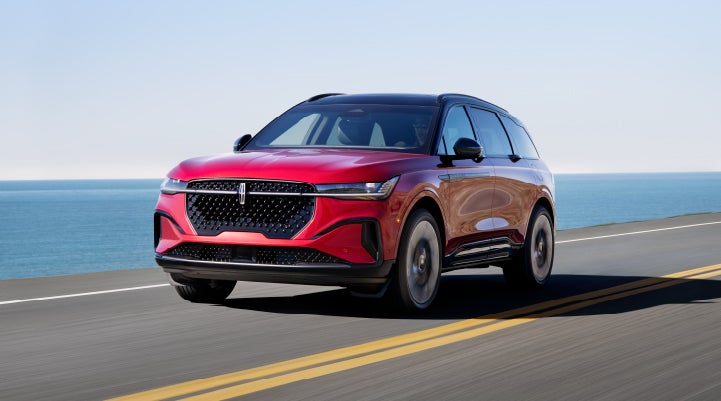 A 2024 Lincoln Nautilus® SUV is being driven on a seaside roadway. | Greenwood Lincoln in Bowling Green KY