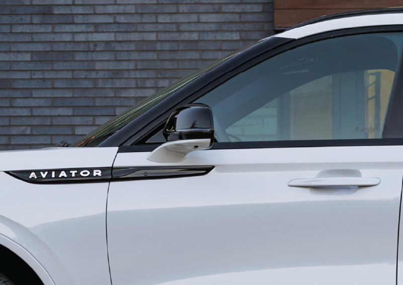 The driver’s door of a white 2025 Lincoln Aviator® SUV is showcased. | Greenwood Lincoln in Bowling Green KY