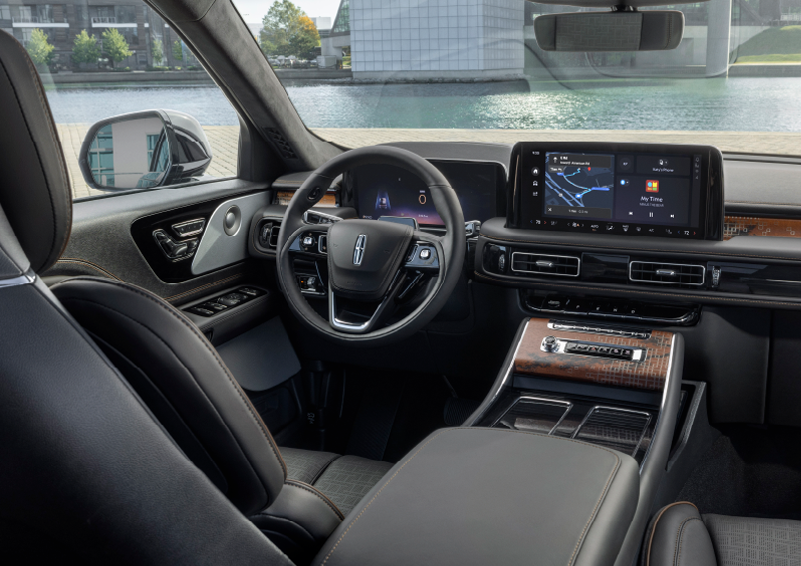 The interior of the 2025 Lincoln Aviator® SUV is shown parked with a view of a harbor through the windshield. | Greenwood Lincoln in Bowling Green KY