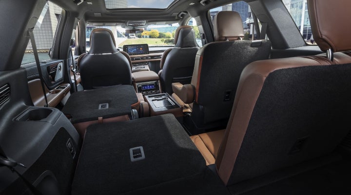 One side of the PowerFold® third-row seat and a second-row seat are folded forward in the 2026 Lincoln Aviator® SUV. | Greenwood Lincoln in Bowling Green KY