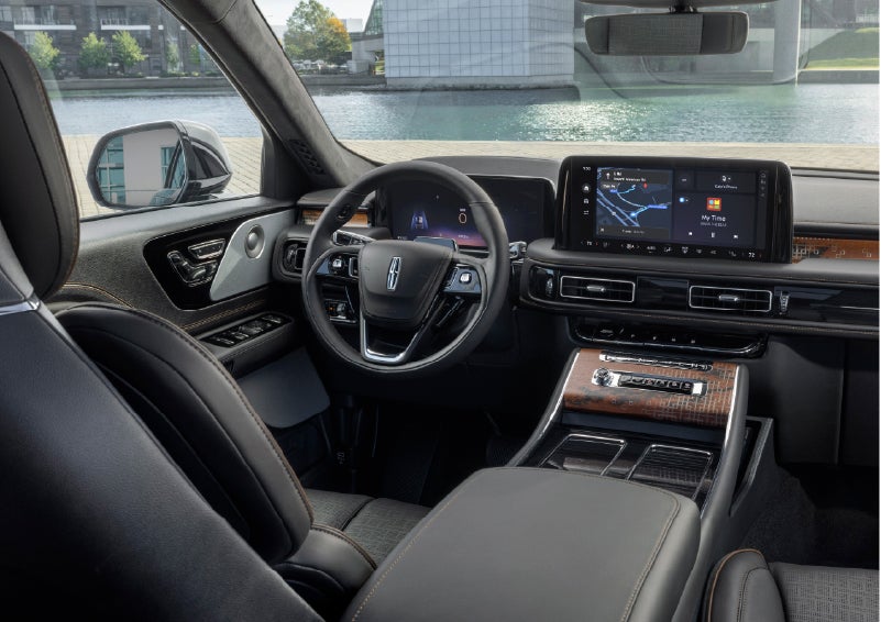 The interior of the 2026 Lincoln Aviator® SUV is shown parked with a view of a harbor through the windshield. | Greenwood Lincoln in Bowling Green KY