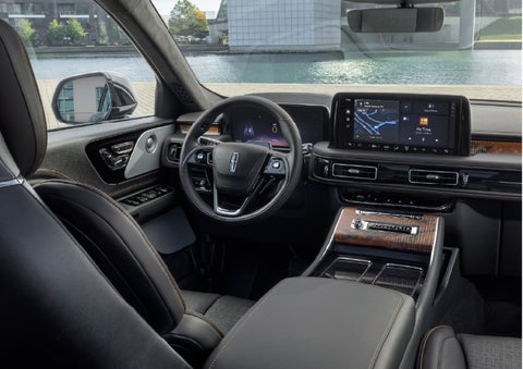 The interior of the 2026 Lincoln Aviator® SUV is shown parked with a view of a harbor through the windshield. | Greenwood Lincoln in Bowling Green KY
