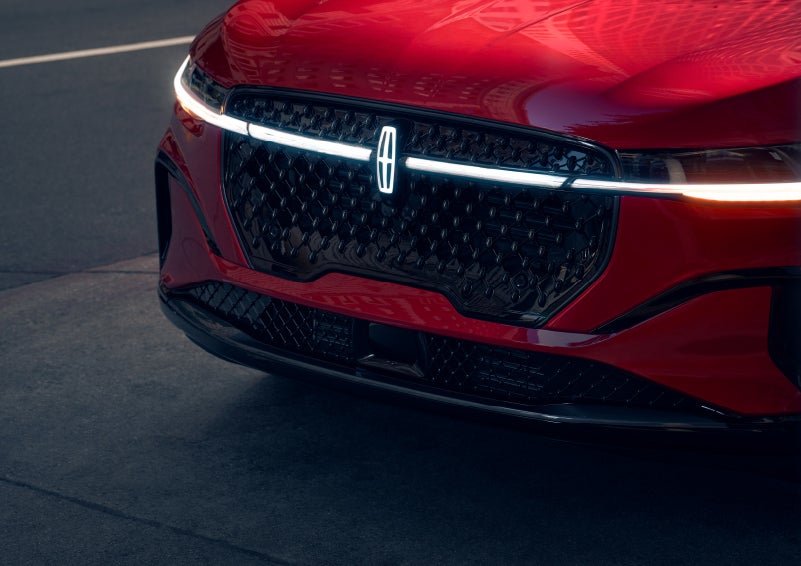 The available front LED light bar and center Lincoln Star logo glow at dusk. | Greenwood Lincoln in Bowling Green KY