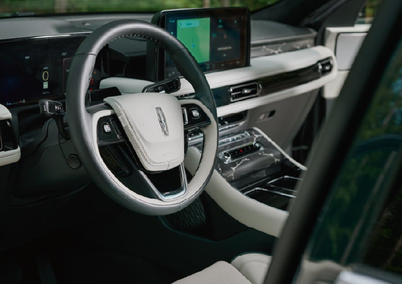 The leather-trimmed steering wheel of a 2027 Lincoln Aviator® Black Label™ SUV. | Greenwood Lincoln in Bowling Green KY