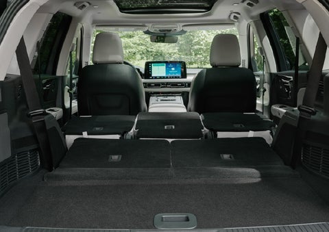 A rear to front view of the interior of a 2027 Lincoln Aviator® Black Label™ SUV shows the third and second rows folded flat | Greenwood Lincoln in Bowling Green KY